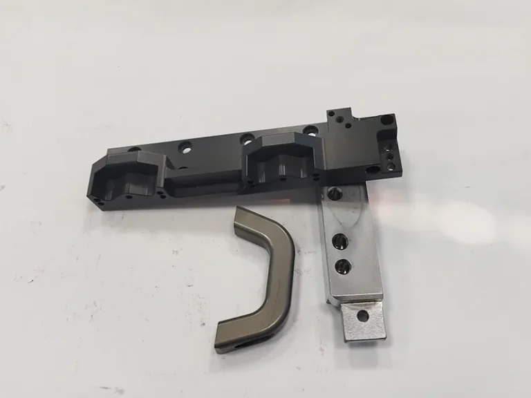 Black anodized rail housing + bright slide bar + swept contour link, view 1