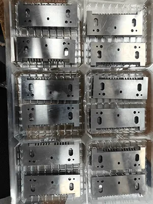 Milled stainless steel plates batched in blister trays after machining