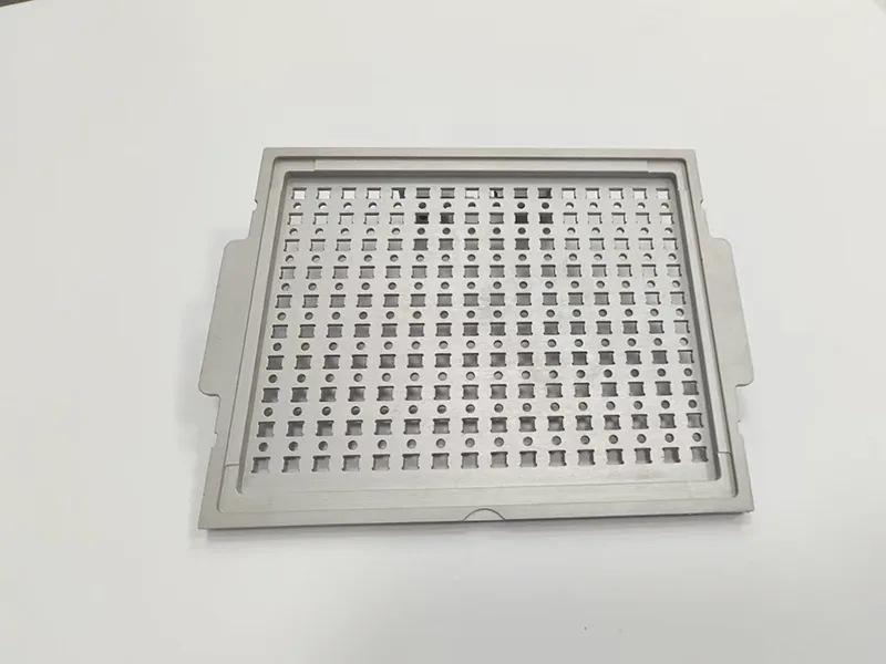 Perforated carrier plate and matching pocketed nest plate