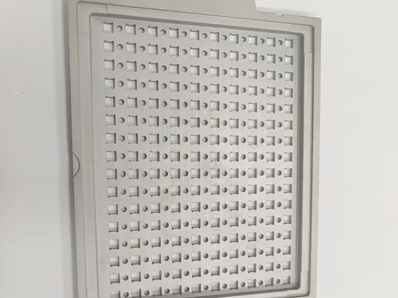 Perforated carrier plate + matching pocketed nest plate, view 4