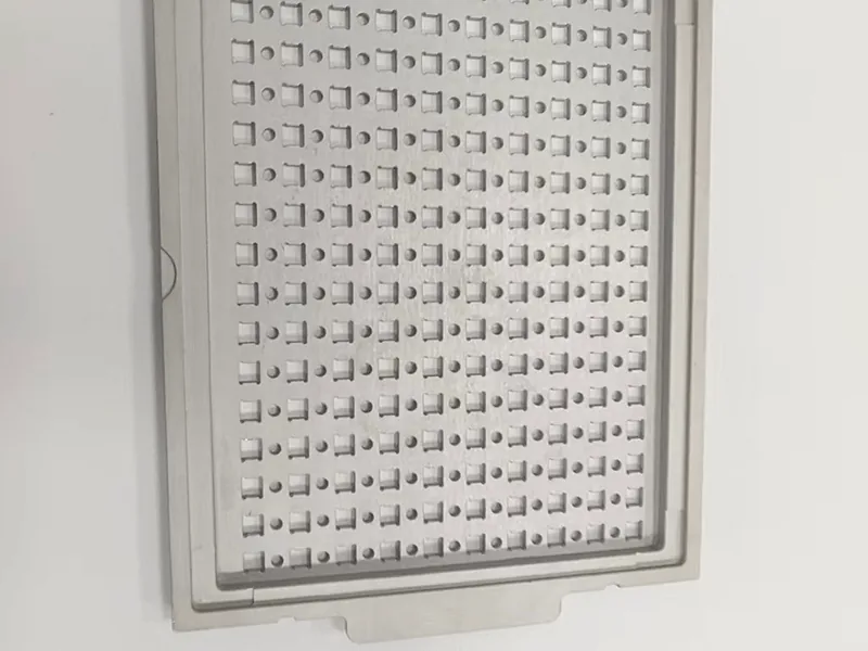 Perforated carrier plate + matching pocketed nest plate, view 5