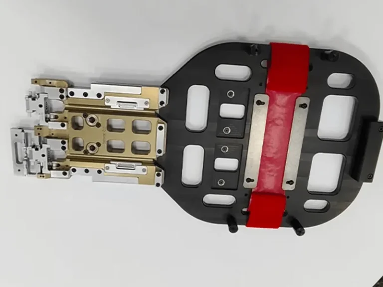 Robot end-of-arm gripper: pocketed base plate, red urethane pads, anodized manifold, stainless fingers, view 8