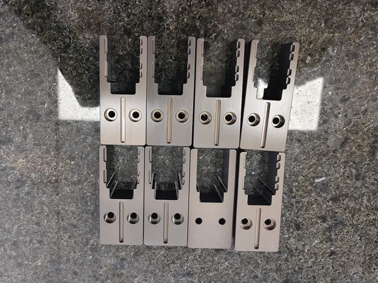 8x comb-slot carrier blocks on a granite plate, view 1