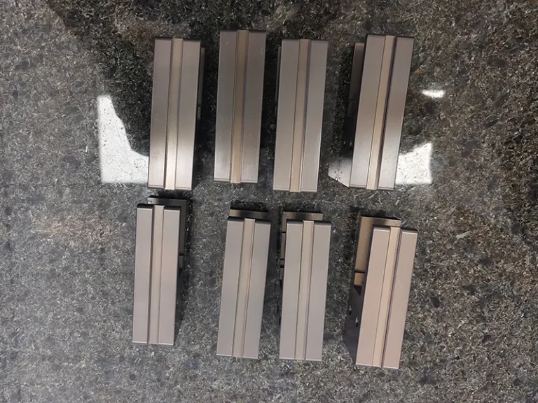 8x comb-slot carrier blocks on a granite plate, view 3