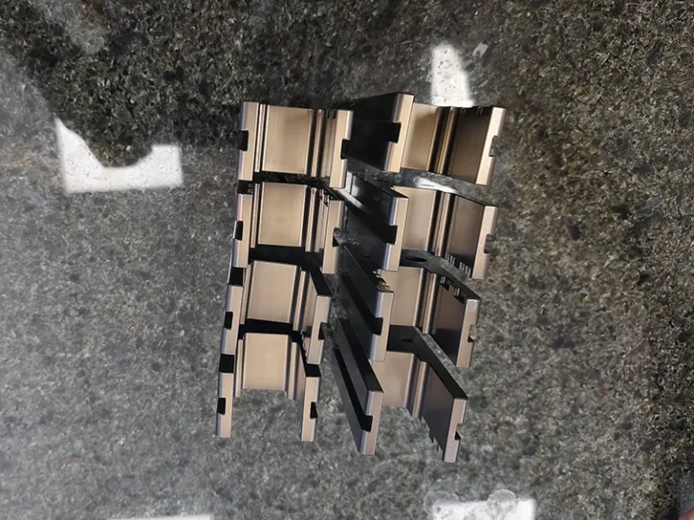 8x comb-slot carrier blocks on a granite plate, view 4