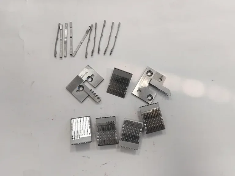 Connector stamping die blade insert set + formed contact blades (wire EDM), view 1