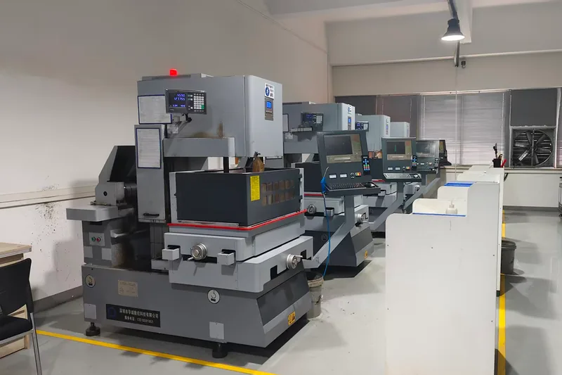 Four wire-cut EDM machines in the EDM room